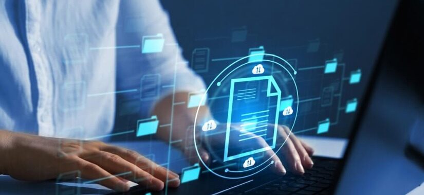 Professional working on a laptop with digital icons, showcasing GDPR data processor duties.