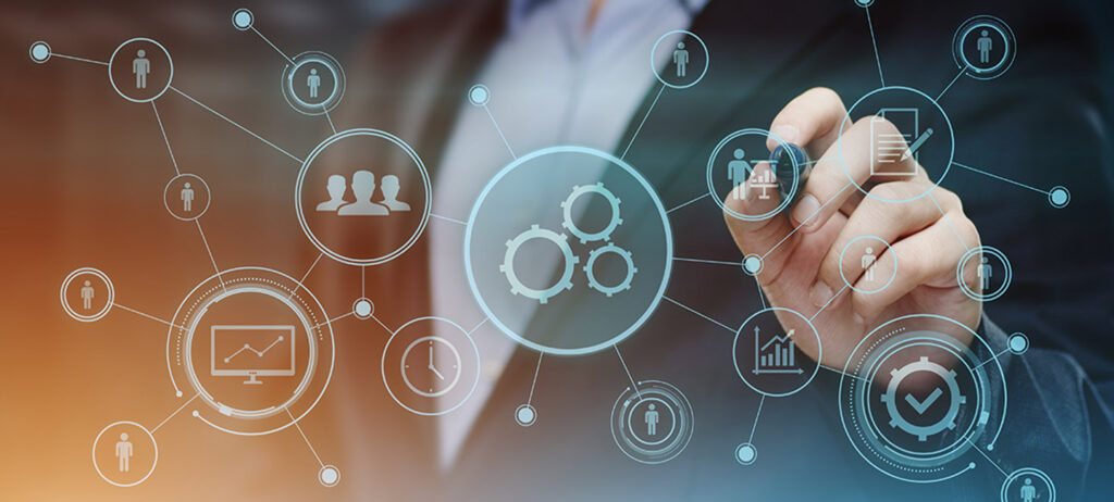 Businessman’s hand with virtual icons, symbolising fractional CTO hiring.